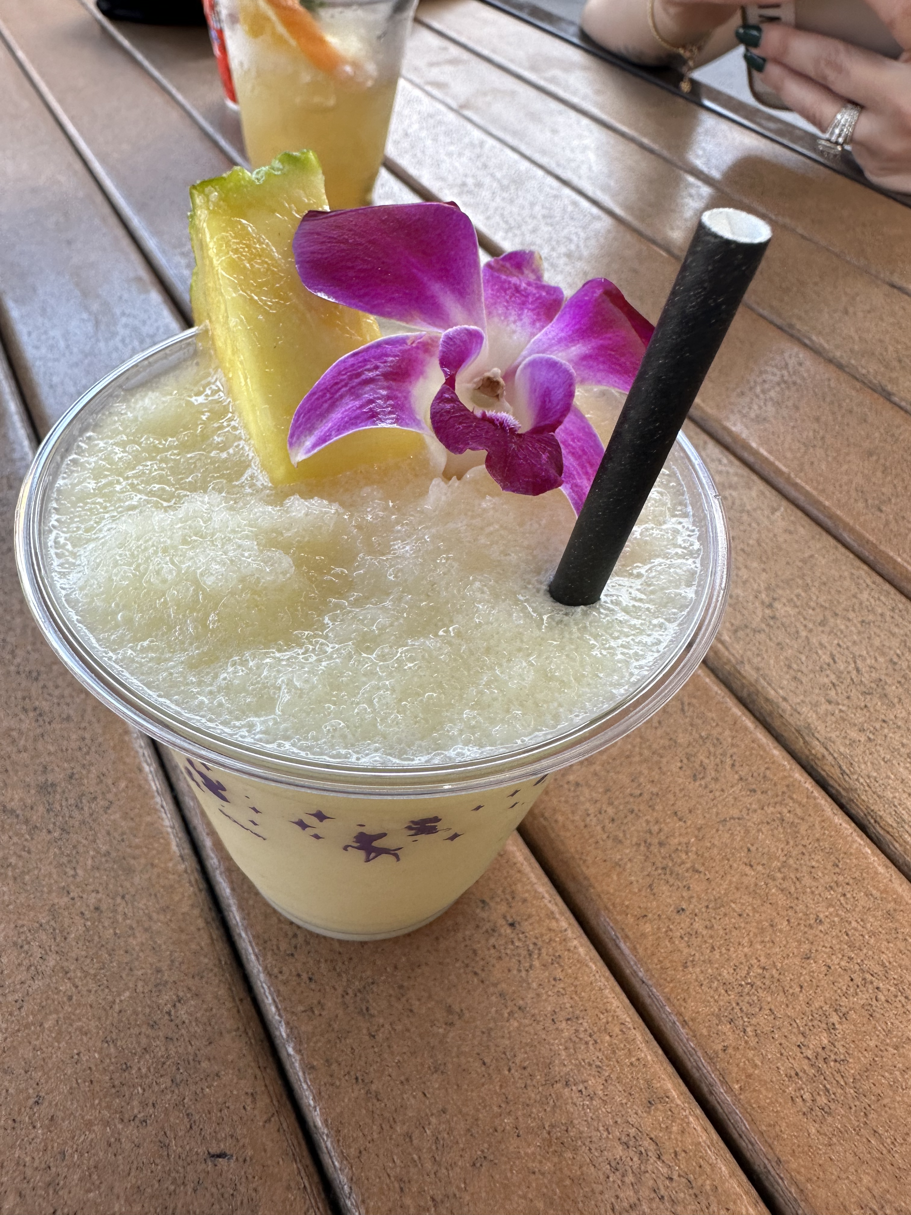 Virgin Pina Colada at Trader Sam's Tiki Terrace with orchid and pineapple slice garnish